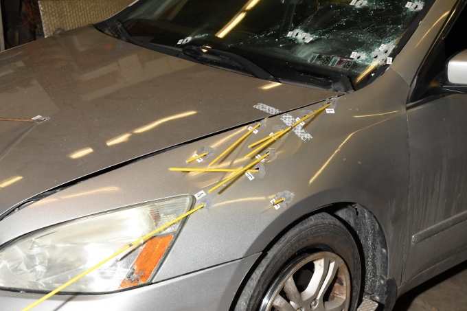 Exterior trajectory examination of the Complainant's Honda Accord, depicting the paths of the bullets which hit the vehicle.