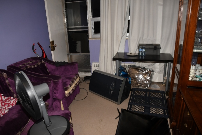 Figure 1 - The apartment where the incident occurred.  A portable air conditioning unit is on its side and a television is on the ground.
