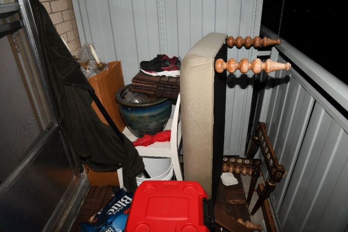 Figure 3 - A closer look at the area of the balcony that Ms. Korchinski-Paquet traversed. There is a 1.1 metre railing with a tall metal partition separating the balcony from a neighbouring apartment's balcony.