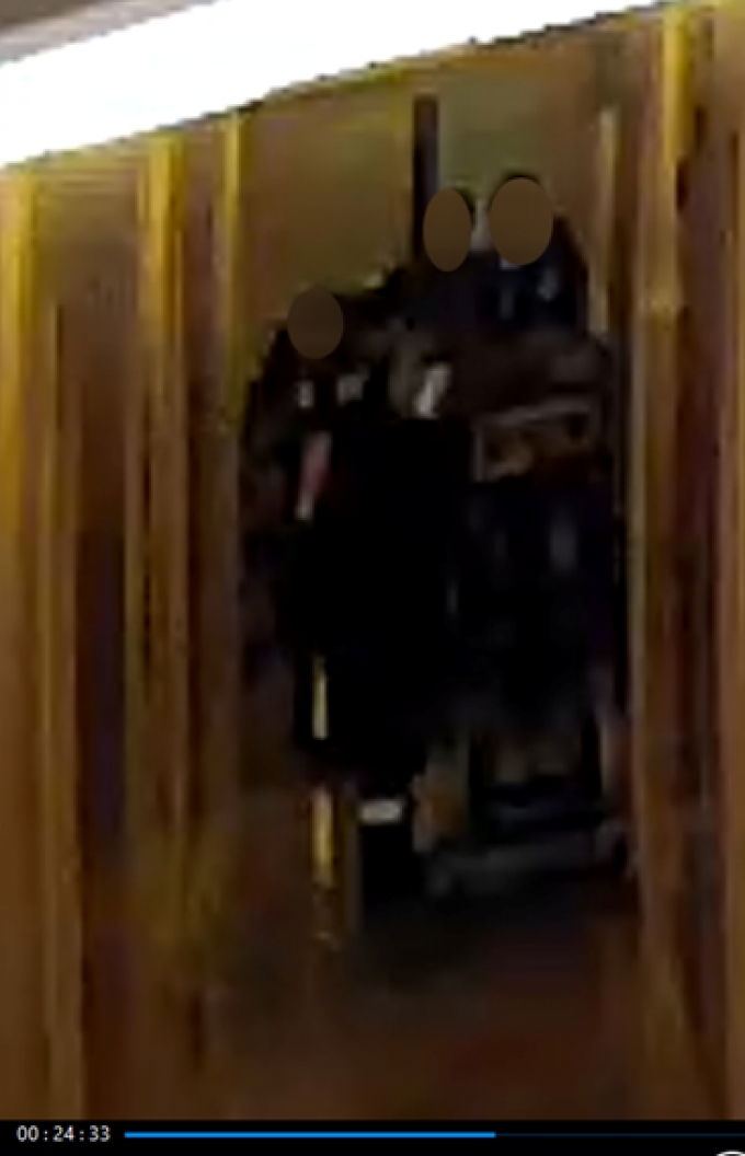 Figure 7 - A still image from the security video recording depicting CW #7 exiting the apartment.