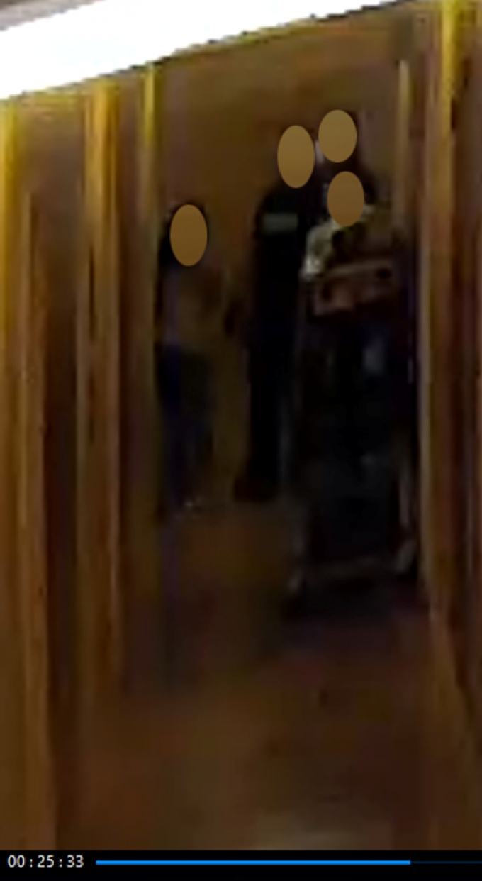 Figure 10 - A still image from the security video recording depicting CW #7 exiting the apartment.