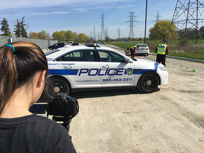 This image shows students from White Oaks Secondary School setting up for a video shoot as part of the SIU’s video series that set out to provide informative answers to frequently asked questions about the Unit.