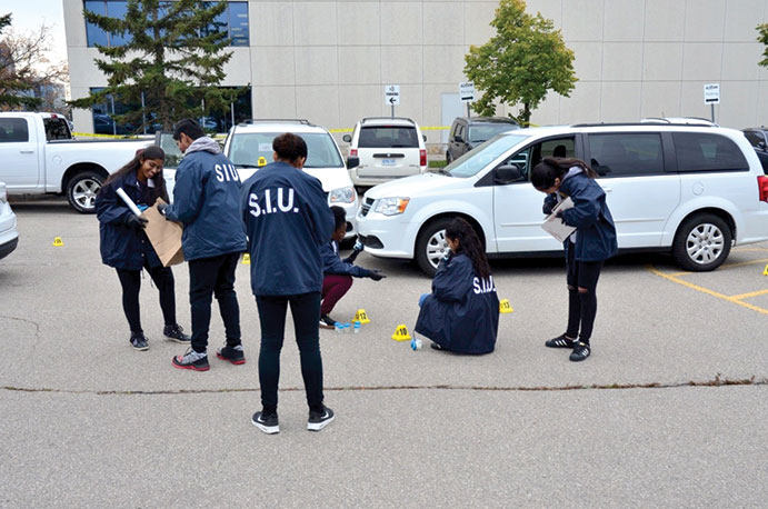 This is a photo of students collecting evidence at the scene.