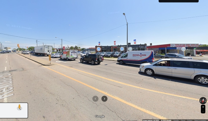 Figure 2 - Screenshot from Google Maps Streetview depicting 301 Rexdale Boulevard, including the driveway egress used by the Complainant and the median he traversed
