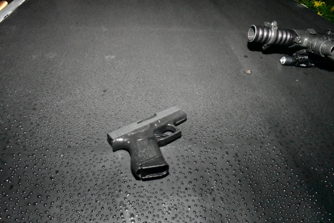 Figure 1 - Glock pistol and ARWEN located on the tonneau cover of Vehicle #2