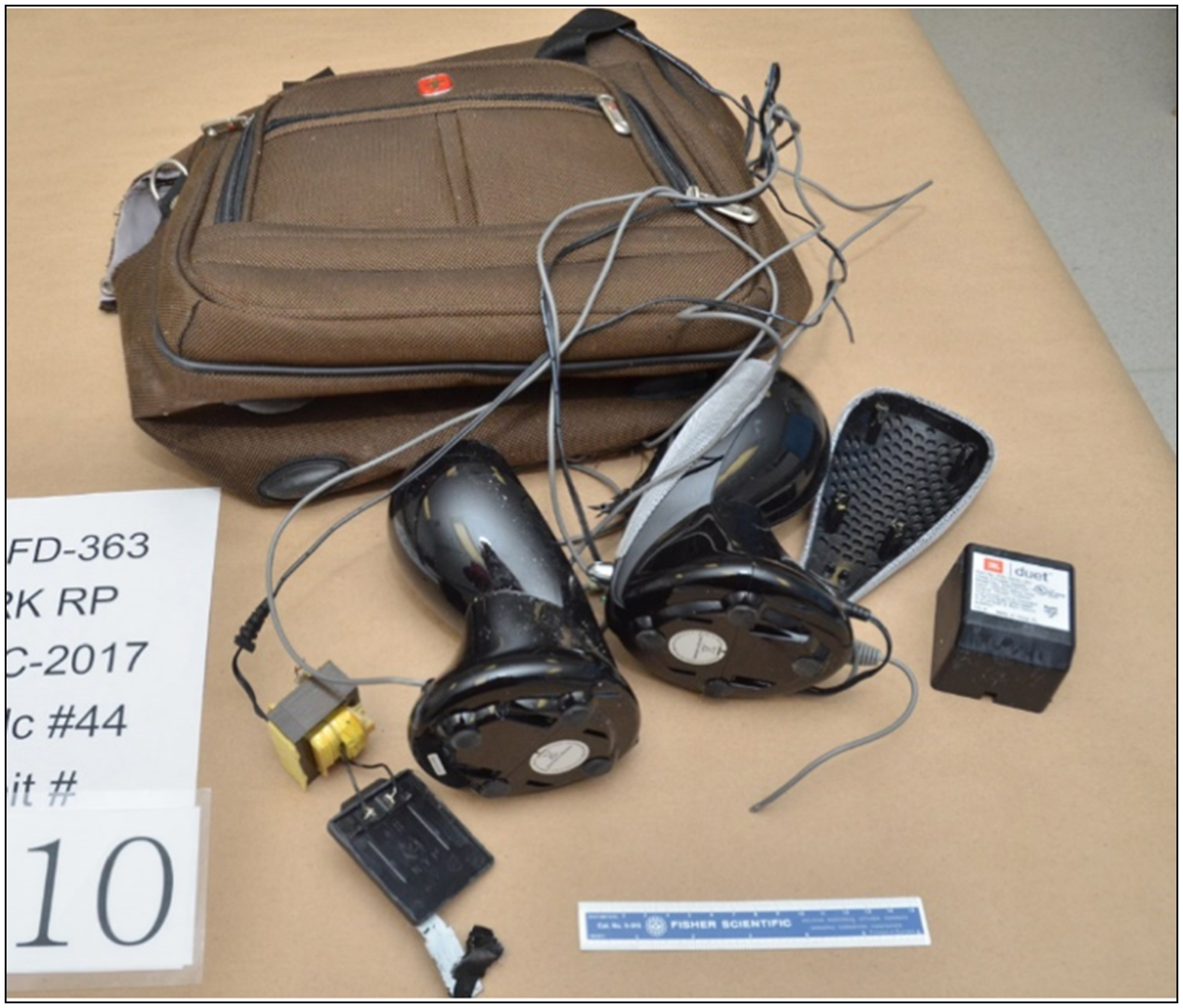 a fabric travel bag containing miscellaneous electrical components