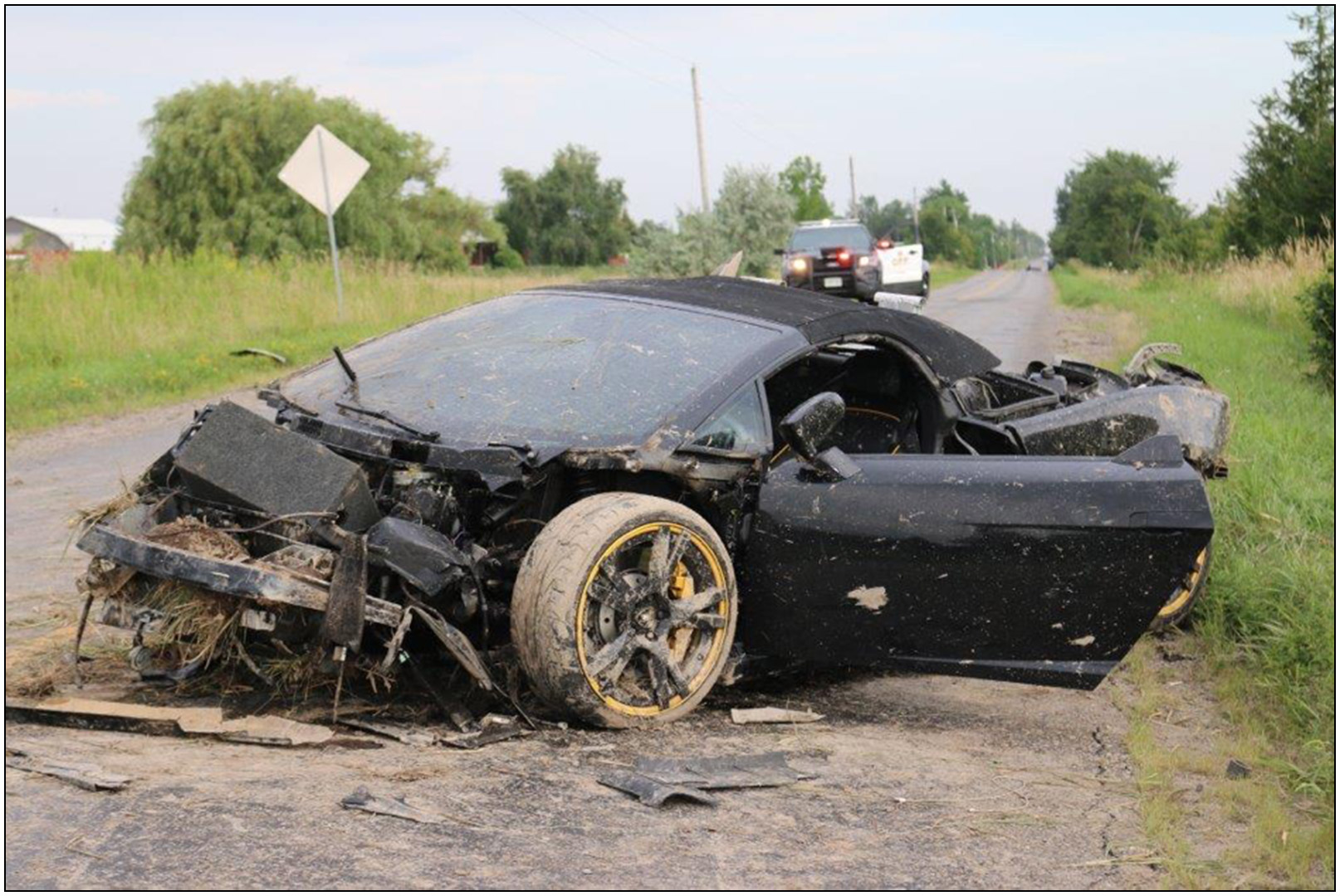 Photos of damaged Lamborghini at scene
