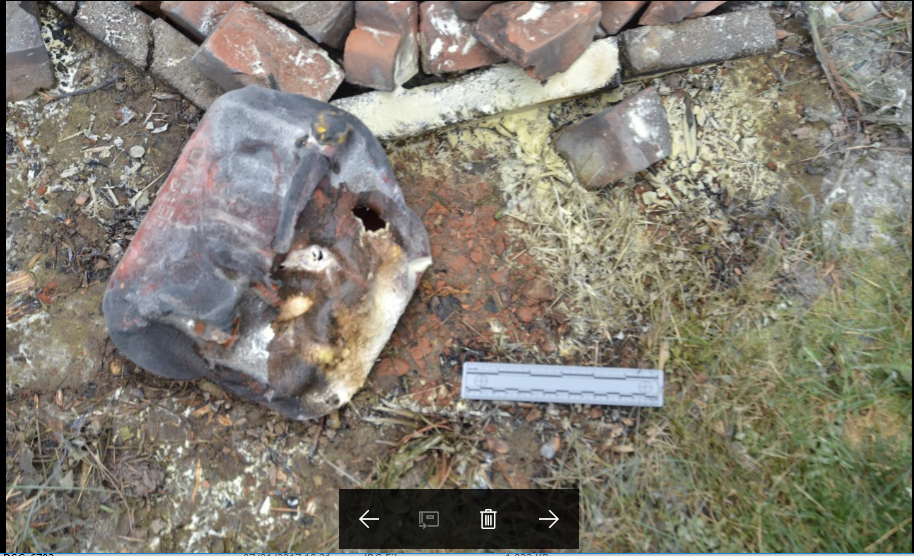 Evidence - photo - a melted five gallon gasoline container