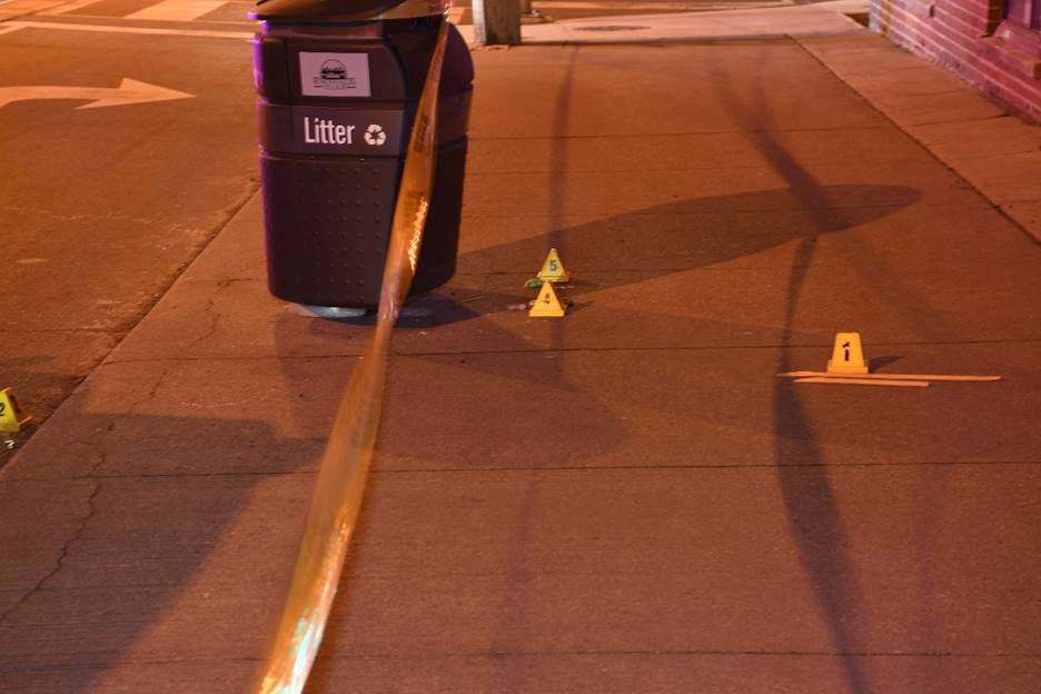 Figure 1 – Scene with evidence markers indicating the location of the wooden dowels, shotgun shell casings and LL rounds
