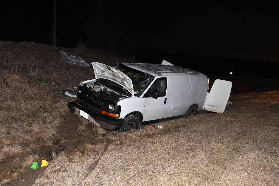 Vehicle 1 - Complainant's GMC Savana at the scene