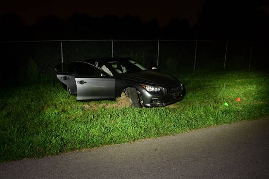 Figure 3 - The vehicle located on a grassy area off the road.